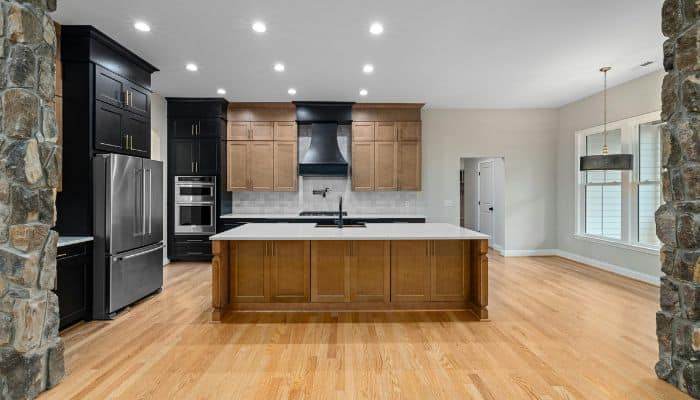 Example of effective kitchen lighting with ambient and accent layers enhancing modern design